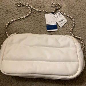 White shoulder bag.